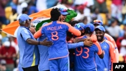 Team India celebrates after winning ICC men's Twenty20 World Cup 2024 final cricket match between India and South Africa at Kensington Oval in Bridgetown, Barbados, on June 29, 2024. (Photo by Chandan Khanna / AFP)